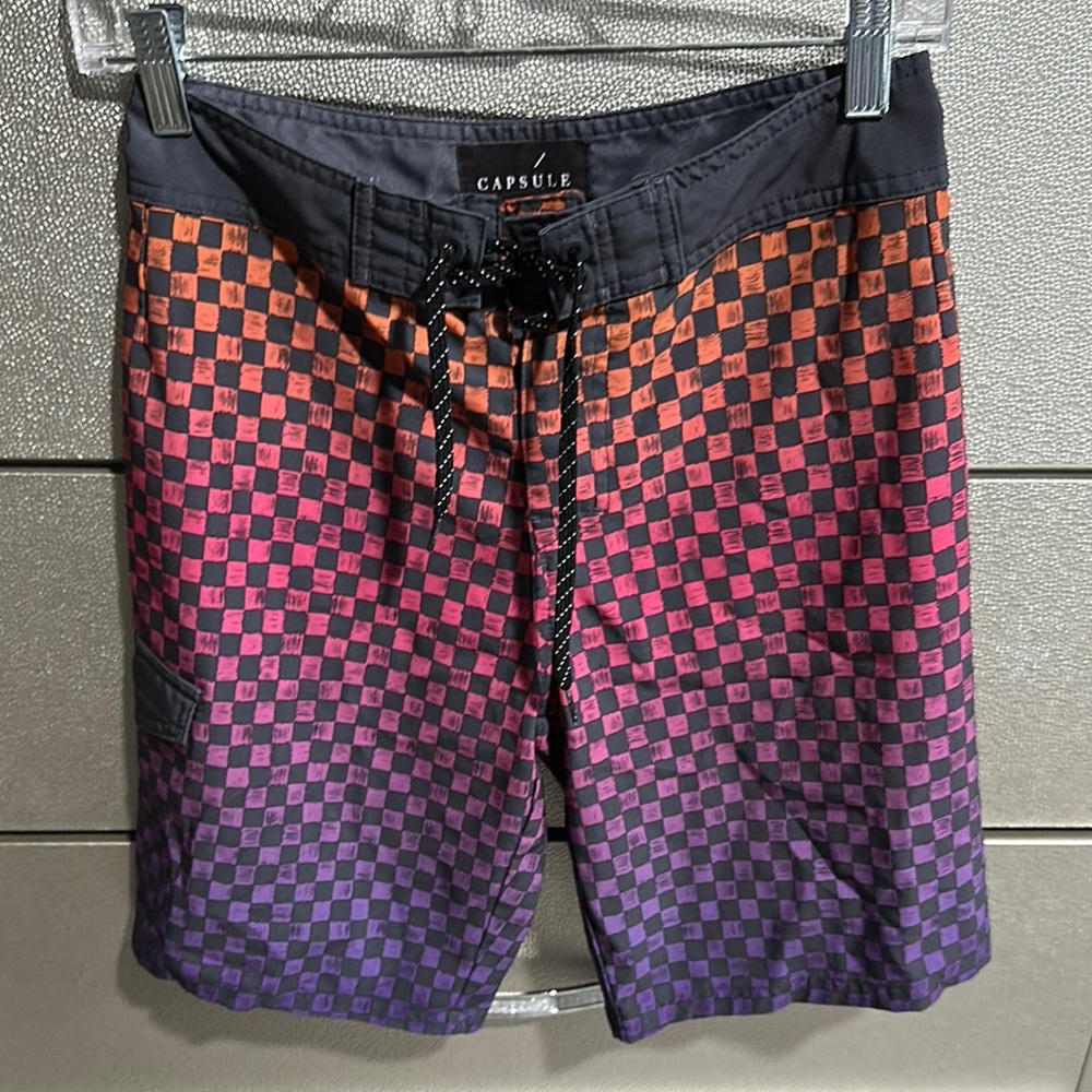 Dynamic Black and Orange Board Shorts for Swim
